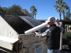 MAN DISPOSING OF ARSENIC FILTER